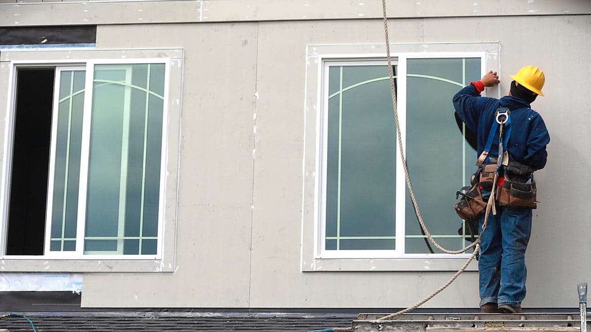 Worker installing windows - Example 4